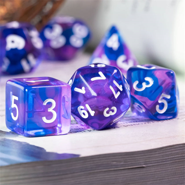 Blue & Purple Transparent Dice - Set of transparent blue and purple acrylic dice with white numbering, including d20, d12, d10, and d6 shapes.