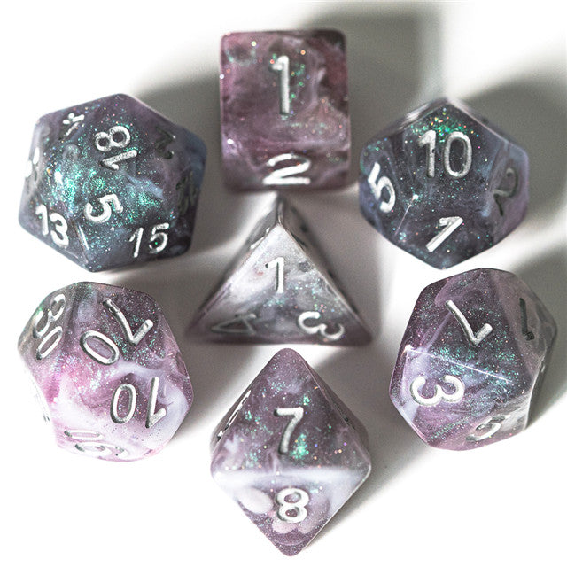 Pink & Blue Galaxy Glitter Dice Set - Set of seven polyhedral dice with pink and blue galaxy glitter pattern and white numbers.