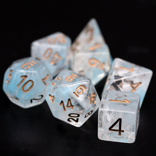 Cyan Smoke Dice Set - Translucent cyan smoke dice set with gold and black numbers, including d20, d12, d10, d8, d6, and d4 on black background.