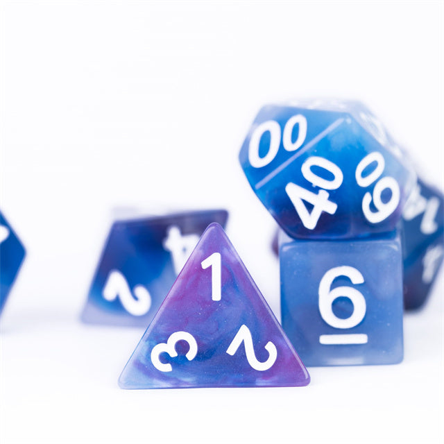 Blue Jade Resin Dice Set - Blue and purple translucent resin dice set with white numbering including d20, d4, and d6 shapes.