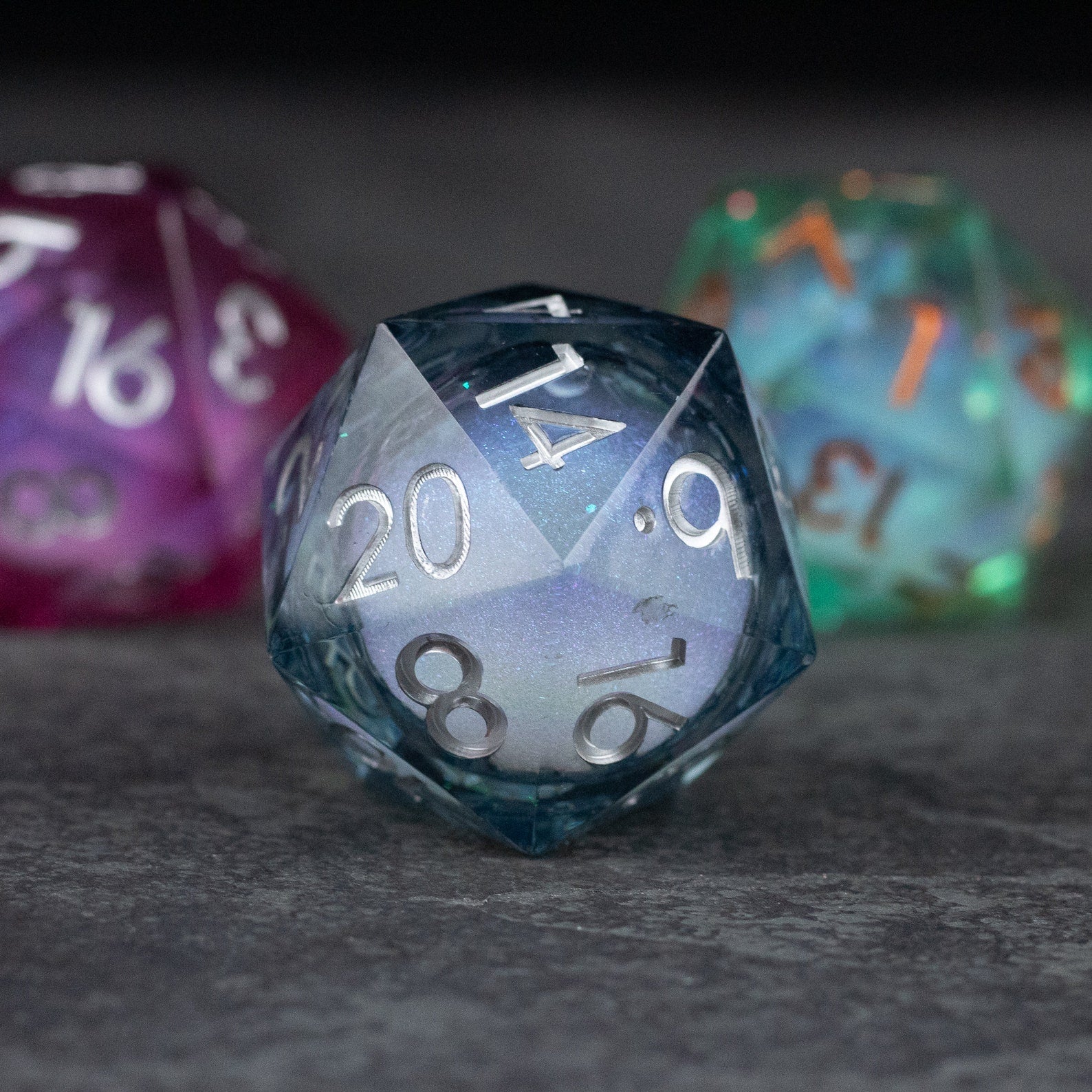 33mm Liquid Core D20 Chonk - Midnight Blue - 33mm midnight blue liquid core D20 die with white numbering and a translucent finish.