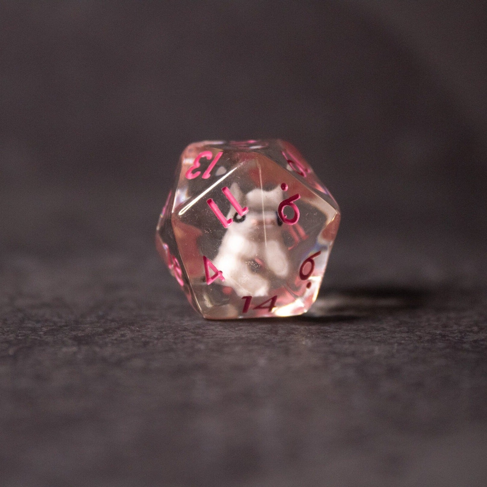 Pink Bunny Dice - Clear 20-sided dice with a small pink bunny figure inside and red numbers on each face.