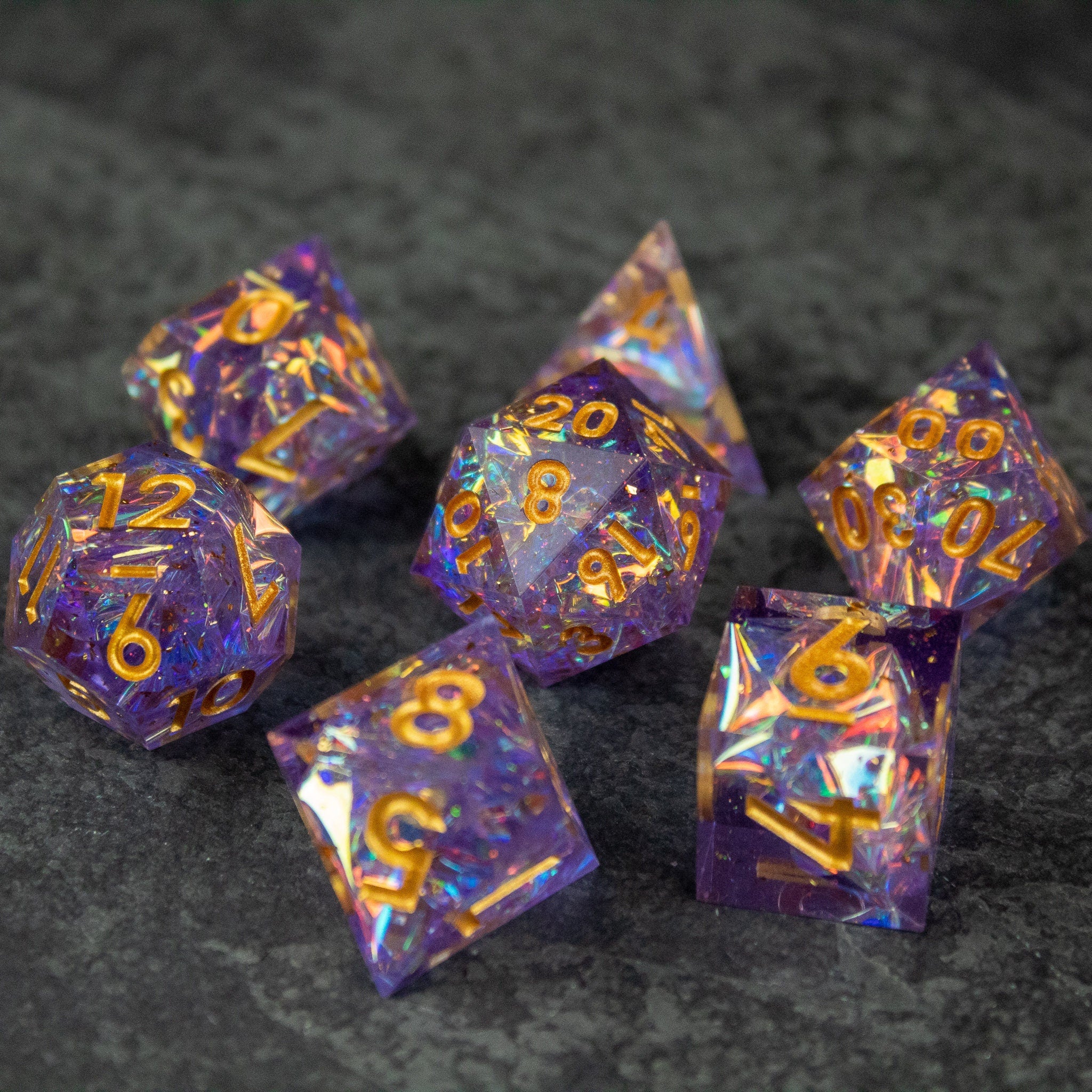 Feywild DnD Dice Set - Sharp Edge Dice for D&D - Purple and gold sharp-edge polyhedral dice set with glitter accents for D&D gaming.