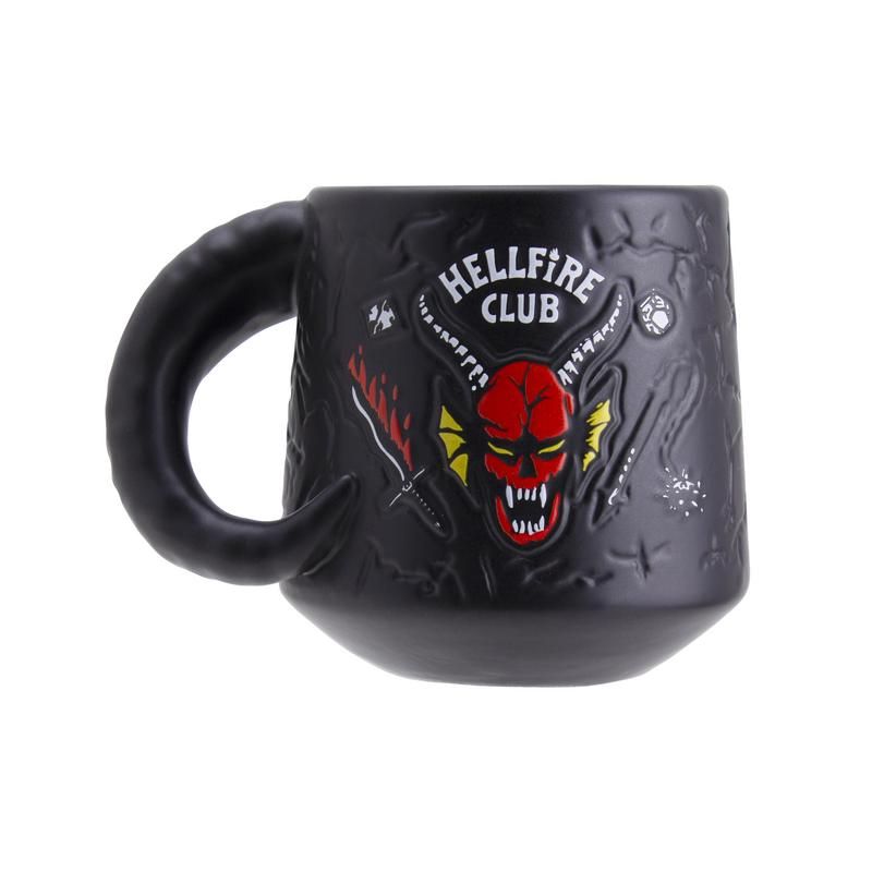 Hellfire Club Mug - Black ceramic mug with a curved handle, featuring a red demonic face and "Hellfire Club" text embossed on the front.