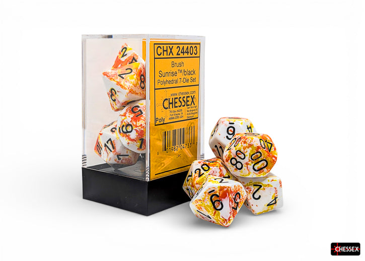 Chessex Polyhedral 7-Die Set - Sunrise/black - Seven acrylic polyhedral dice in sunrise gradient with black numbers, including d4, d6, d8, d10, d12, d20, and percentile.