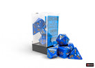 Chessex Polyhedral 7-Die Set - Wavebreak/gold - Seven blue acrylic polyhedral dice with gold numbering, displayed next to clear plastic packaging with black base.