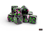 Chessex d6 Dice Block - Paintball/green 16mm (12 dice) - Set of twelve black acrylic six-sided dice with bright green pips and pink paint splatter accents, 16mm size.