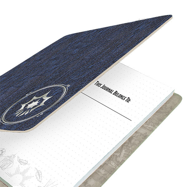 D&D Class Premium Campaign Journal - Cleric Class (PREORDER) - Blue fabric-covered journal with silver embossed emblem and dotted grid pages inside.
