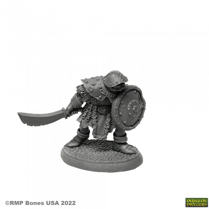 Orc Warrior of the Ragged Wound - Detailed unpainted Orc warrior miniature with spiked armor, curved sword, and round shield on textured base.