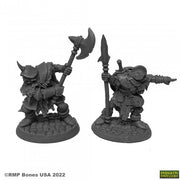 Orcs of the Ragged Wound Leaders (2) - Two detailed gray resin orc warrior miniatures, one wielding a large axe and the other holding a spear and pointing forward, .