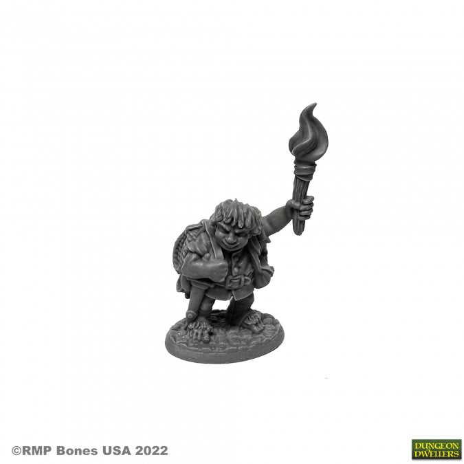 Gus Greenweevil, Halfling Henchman - Gray plastic miniature of a halfling holding a flaming torch, crouched on a textured base.
