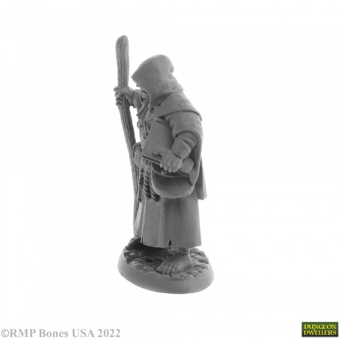 Brother Hammond, Travelling Monk - Gray resin miniature of a fantasy monk in a hooded robe holding a staff and wearing gloves and boots.