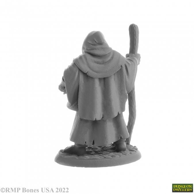 Brother Hammond, Travelling Monk - Gray resin fantasy miniature of a robed traveling monk holding a staff, back view.
