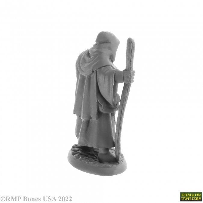 Brother Hammond, Travelling Monk - Gray resin miniature of a robed monk holding a tall wooden staff, standing on a textured base.