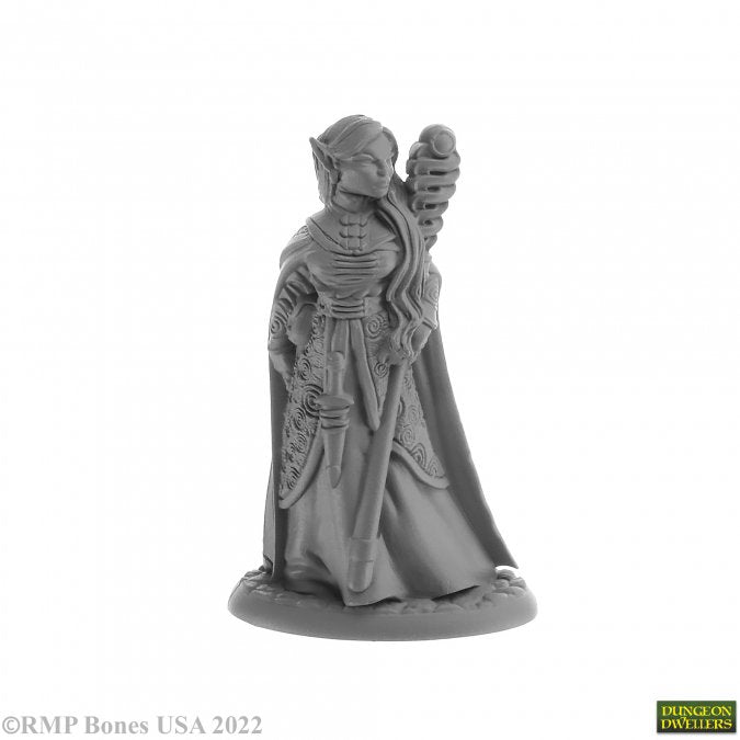 Anthanelle, Elf Wizard - Gray resin figurine of an elf wizard with pointed ears, holding a tall staff, wearing layered robes and a flowing cape.