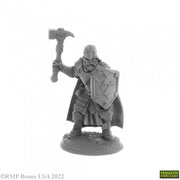 Balzador, Human Cleric - Gray unpainted miniature of armored cleric holding a war hammer and a shield with a cross emblem.