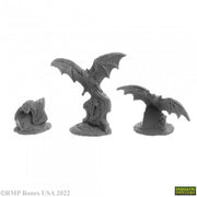 Giant Bats (3) - Three detailed gray miniature giant bats in different poses, sculpted with textured wings and bodies.