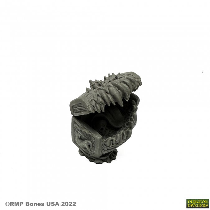 Mockingbeast - Dark gray miniature fantasy creature with spiked ridges and open mouth showing detailed teeth.