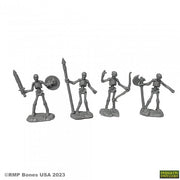 Skeleton Warriors (4) - Four gray plastic skeleton warrior figurines holding a sword, spear with shield, raised fist, and double axes.