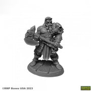 Kreed Bloodbeard - Gray resin miniature of a muscular warrior with a thick beard holding a large battle axe and skull-adorned shoulder armor on
