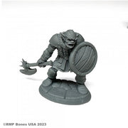 Kadarg, Scarneck Hobgoblin Warrior - Gray plastic hobgoblin warrior miniature wielding a spiked axe and round wooden shield on a textured base.