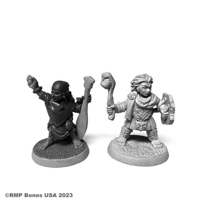 Halfling River Witch and Druid - Two unpainted miniature fantasy figures, one holding a skull-topped staff and shield, the other with a raised axe and potion