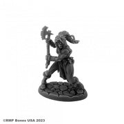 Hyborian Heroine - Black unpainted resin miniature of a female warrior holding an axe, standing on a textured stone base.