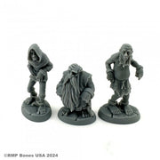 Townsfolk: Prisoners - Three gray resin miniatures of prisoners with ragged clothing and chains, each on round bases.