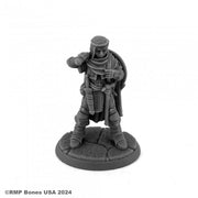 Thiann Valand, Human Cleric - Gray unpainted resin miniature of a human cleric holding a mace and shield, standing on textured round base.