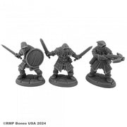 Bandits - Three detailed gray plastic miniatures of bandits, each with medieval armor; one holds a round shield and sword, another.