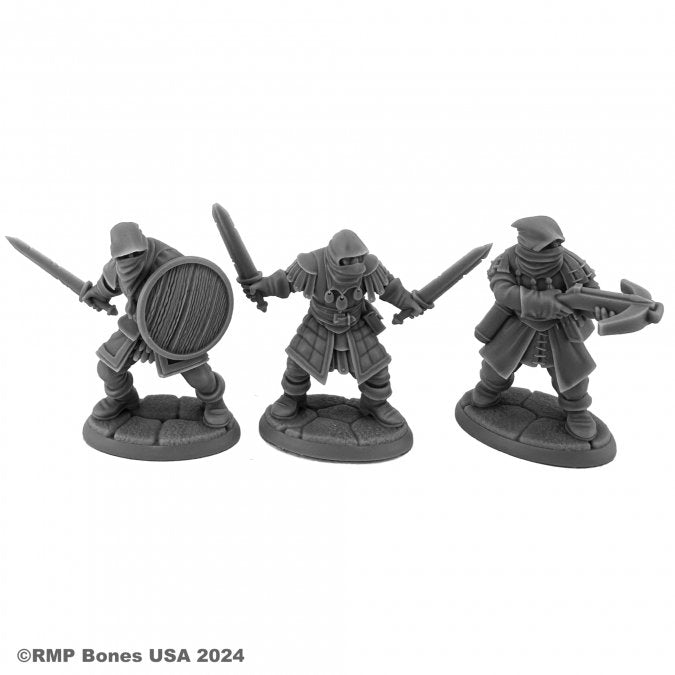 Bandits - Three detailed gray plastic miniatures of bandits, each with medieval armor; one holds a round shield and sword, another.