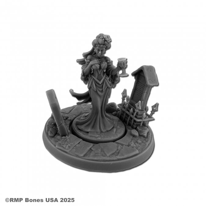 Sadraseth, Vampire Queen - Dark gray resin miniature of a vampire queen in regal flowing gown holding a goblet, standing on a textured round base with.