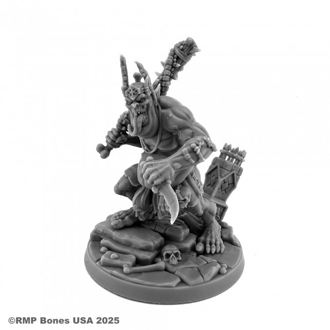 Garravank the Ghoul King - Gray plastic miniature of a muscular goblin king wearing a crown and loincloth, wielding a spiked club and standing on a.