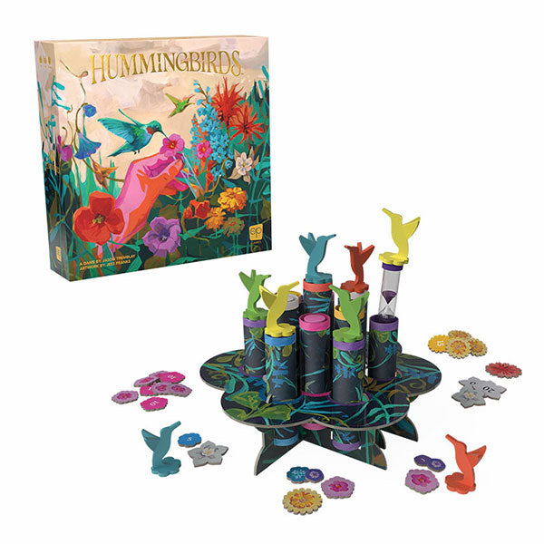 Hummingbirds (PREORDER) - Colorful board game with tall cylindrical towers and hummingbird-shaped game pieces on a floral-patterned circular base.
