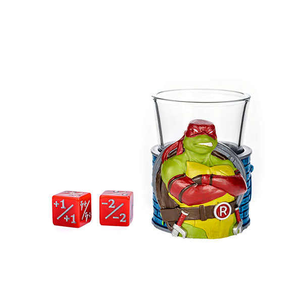 MTG Teenage Mutant Ninja Turtles Mini Cups Blind Box - Clear glass mini cup featuring colorful Teenage Mutant Ninja Turtles wrap and two red six-sided dice with white numbers and.