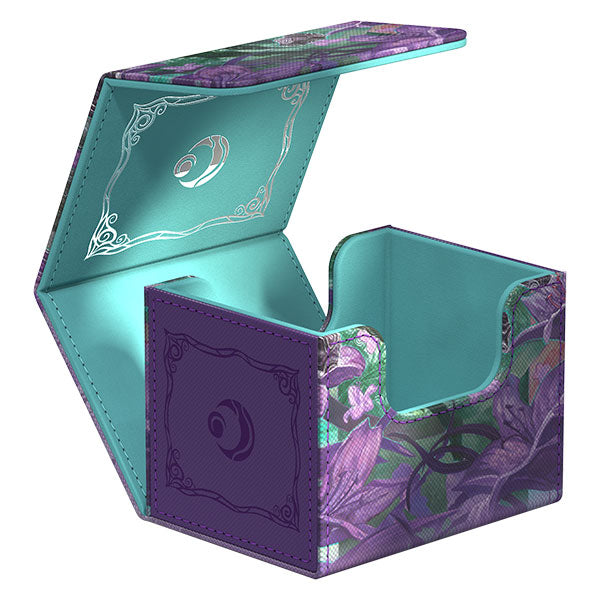Ultimate Guard Sidewinder 100+ Xenoskin Deckcase: Lorwyn Eclipsed - Mornsong Aria - Purple and teal floral-themed card deck case with hinged lid and intricate patterns on interior and exterior surfaces.
