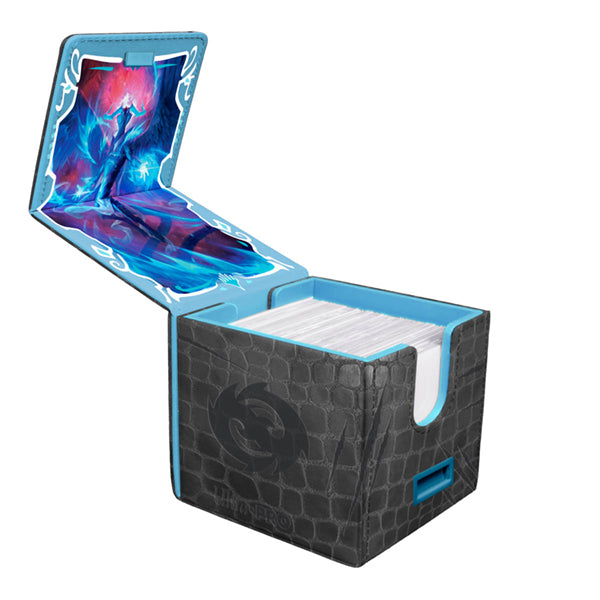 Alcove Edge Deckbox - Tarkir Dragonstorm - Ugin, Eye of the Storms - 100+ - Black textured deckbox with blue edges, featuring fantasy dragon artwork inside the lid, holding over 100 cards.