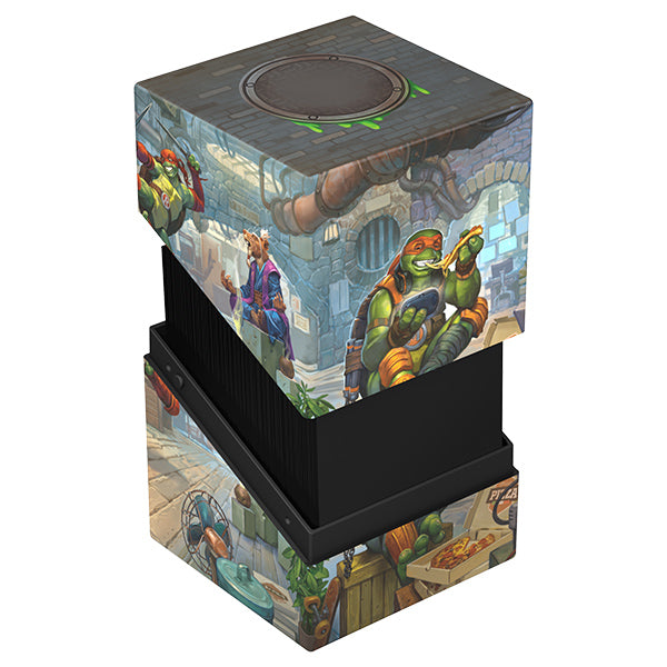 Ultimate Guard RTE Boulder 100+ Deck Case: Teenage Mutant Ninja Turtles - Turtle Lair - Rectangular card deck case with black base and colorful Teenage Mutant Ninja Turtles lair art on lid and sides.