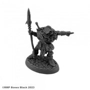 Orc Leader (Pointing) - Black resin miniature of an orc warrior holding a spear and pointing forward, standing on a textured oval base.