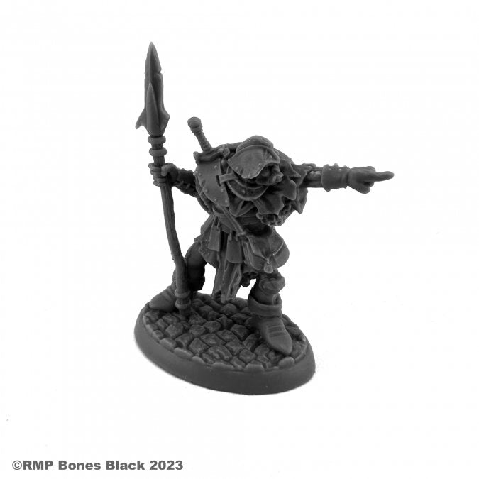 Orc Leader (Pointing) - Black resin miniature of an orc warrior holding a spear and pointing forward, standing on a textured oval base.