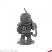 Gingerbread Knight - Gray resin miniature of a smiling gingerbread knight holding a candy cane sword with a sack over one shoulder.