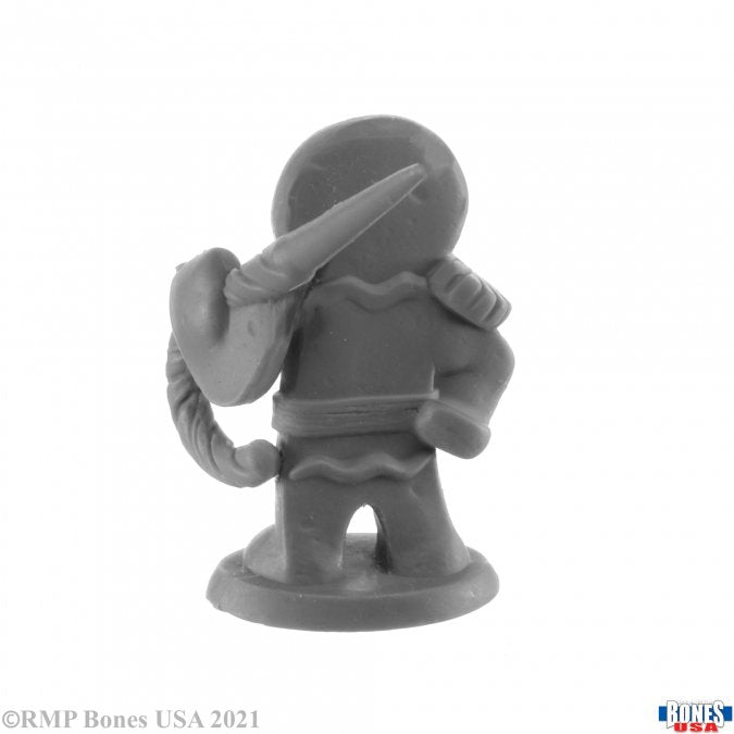 Gingerbread Knight - Unpainted resin miniature of a gingerbread knight holding a sword behind its back with armor details and scalloped edges.