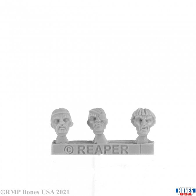 Build-a-Figure Modular Pirate (3) - Three gray plastic miniature pirate heads with distinct facial features on a single sprue, made for tabletop gaming.