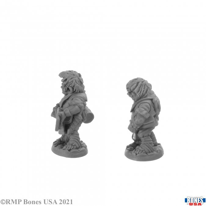 Chop and Grub, Halfling Cooks - Detailed gray resin miniature of a stout halfling cook wearing a textured apron and carrying a cooking pot, standing on a.