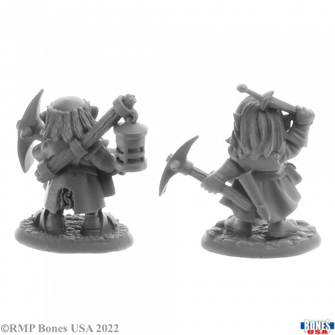 Deep Gnome Heroes (2) - Two gray resin fantasy miniatures of deep gnome heroes, each holding a pickaxe and lantern, standing on textured bases.