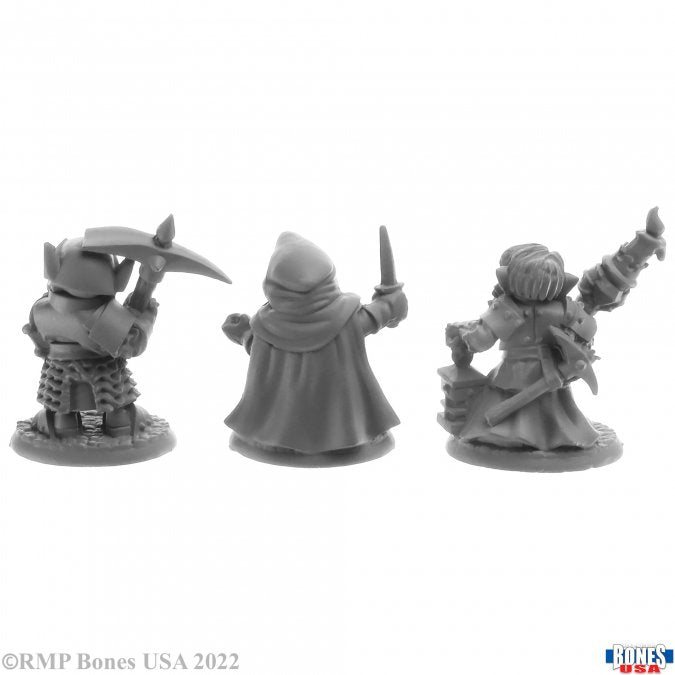Deep Gnome Warriors (3) - Three detailed gray plastic fantasy warrior miniatures, each with distinct armor and weapons, posed dynamically.