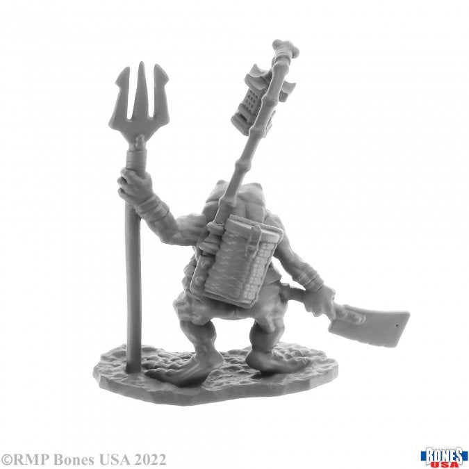 Bufo, Dreadmere Frogman - Gray plastic miniature of a frog-like humanoid holding a trident and carrying a backpack and a cleaver weapon.