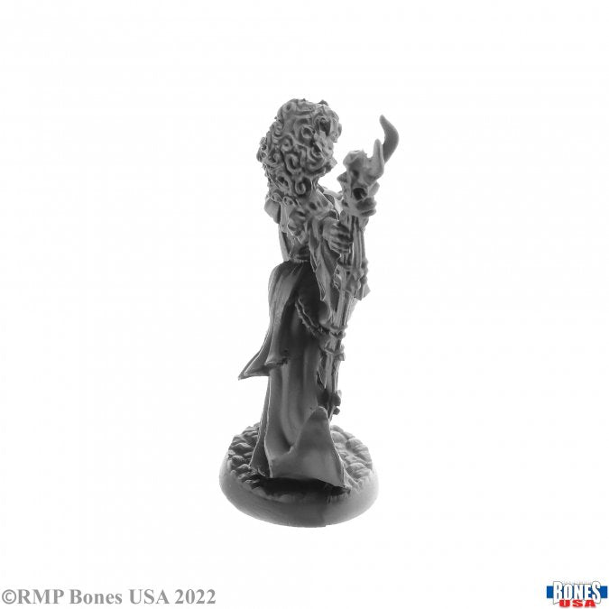Andowyn Thrushmoor, Human Druid - Gray resin miniature of a robed human druid holding a staff with leaves and vines, standing on a textured base.