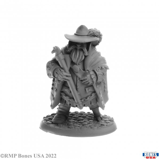 Reeve Irremborg Planomap - Gray unpainted fantasy miniature figure of a cloaked adventurer with wide-brimmed hat and staff on textured base.