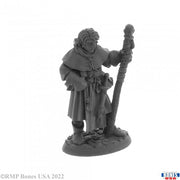 Young Mage - Gray resin miniature of a young mage holding a detailed staff, wearing a cloak and robe, standing on a textured base.